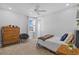 This bedroom features a cozy bed, ample light, and ceiling fan at 28355 Picana, Wesley Chapel, FL 33543