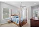 Bedroom with a four-poster bed, neutral walls, a ceiling fan and carpeted floors at 28355 Picana, Wesley Chapel, FL 33543