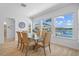 Bright dining room with water views, a glass table, and neutral color palette at 28355 Picana, Wesley Chapel, FL 33543