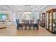 Formal dining room with elegant chandelier and seating for six at 28355 Picana, Wesley Chapel, FL 33543