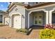 Charming home with three car garage, and a well-manicured lawn and garden at 28355 Picana, Wesley Chapel, FL 33543