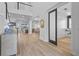 Bright, airy foyer features wood-look tile flooring and views into the living spaces at 28355 Picana, Wesley Chapel, FL 33543