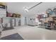 Extra large three car garage with plenty of storage and extra refrigerator at 28355 Picana, Wesley Chapel, FL 33543