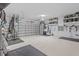 Spacious and organized two-car garage with ample storage, painted walls, and epoxy floor at 28355 Picana, Wesley Chapel, FL 33543