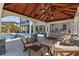 Outdoor gazebo with comfortable seating offers a relaxing space by the pool with backyard views at 28355 Picana, Wesley Chapel, FL 33543