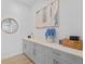 Hallway with gray cabinets, and decor at 28355 Picana, Wesley Chapel, FL 33543