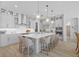 Bright kitchen boasts a large island with seating, stainless appliances, and ample cabinet space at 28355 Picana, Wesley Chapel, FL 33543