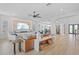 Open living room, bright with a fireplace, and flows to the dining space at 28355 Picana, Wesley Chapel, FL 33543