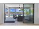 Inviting covered patio with stylish seating area overlooking the serene lake and pool at 28355 Picana, Wesley Chapel, FL 33543