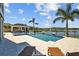 Resort-style pool and spa overlooking a tranquil lake, perfect for outdoor enjoyment at 28355 Picana, Wesley Chapel, FL 33543