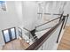 A bright, open staircase with hardwood floors and a modern railing design at 28355 Picana, Wesley Chapel, FL 33543