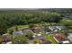 Aerial view of home backing onto a well-maintained golf course with mature trees at 29250 Princeville Dr, San Antonio, FL 33576