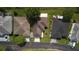 An overhead view of the roof and driveways of homes with manicured lawns at 29250 Princeville Dr, San Antonio, FL 33576