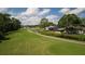 A stunning view of the property backing onto a beautiful golf course and waterway at 29250 Princeville Dr, San Antonio, FL 33576