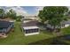 Views of the screened in lanai and nicely maintained yard with pond at 29250 Princeville Dr, San Antonio, FL 33576