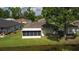 Views of the screened in lanai and nicely maintained yard with pond at 29250 Princeville Dr, San Antonio, FL 33576