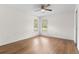Bedroom with durable flooring, neutral paint, ceiling fan, and a window with natural light at 29250 Princeville Dr, San Antonio, FL 33576