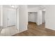 Neutral entryway showing the front door and durable flooring that extends into the living space at 29250 Princeville Dr, San Antonio, FL 33576