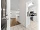 Inviting entryway leading to the open-concept living area and modern kitchen at 29250 Princeville Dr, San Antonio, FL 33576