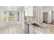 Bright kitchen area with stainless steel appliances and granite countertops at 29250 Princeville Dr, San Antonio, FL 33576