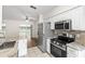 Modern kitchen with stainless steel appliances and marble countertops at 29250 Princeville Dr, San Antonio, FL 33576