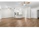 Large living room offering open access to the kitchen featuring stainless appliances at 29250 Princeville Dr, San Antonio, FL 33576