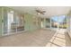 A sunroom with tile flooring and lots of windows at 29250 Princeville Dr, San Antonio, FL 33576