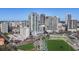 Expansive aerial view showcasing the modern high-rise with surrounding urban landscape, near an athletic field at 301 1St S St # 2205, St Petersburg, FL 33701