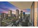 Beautiful balcony with outdoor seating and expansive city views at dusk at 301 1St S St # 2205, St Petersburg, FL 33701