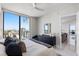 Comfortable bedroom features a bright city view, and a dark dresser at 301 1St S St # 2205, St Petersburg, FL 33701