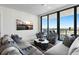 Relaxing living room featuring city skyline art, stylish seating, and a cityscape view at 301 1St S St # 2205, St Petersburg, FL 33701