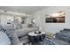 Comfortable living room with modern decor, a large screen TV, and stylish kitchen at 301 1St S St # 2205, St Petersburg, FL 33701