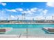 Relaxing rooftop pool features a tanning ledge and lounge chairs overlooking the water and marina at 301 1St S St # 2205, St Petersburg, FL 33701