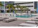 Serene rooftop pool provides a lavish retreat with comfortable seating, lush landscaping and city views at 301 1St S St # 2205, St Petersburg, FL 33701
