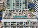 Rooftop pool featuring clear water, ample seating, and lush landscaping offers an urban oasis at 301 1St S St # 2205, St Petersburg, FL 33701