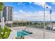 Inviting rooftop pool area with outdoor shower, skyline view, and lush tropical landscaping at 301 1St S St # 2205, St Petersburg, FL 33701