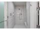 Modern walk-in shower with sleek tile, rainfall showerhead, and built-in bench at 301 1St S St # 2205, St Petersburg, FL 33701