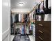 Spacious walk-in closet with custom shelving, ample storage, and stylish rug at 301 1St S St # 2205, St Petersburg, FL 33701