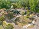 Aerial view of the home highlighting its location, expansive driveway, and mature trees at 320 Lake Maggiore S Blvd, St Petersburg, FL 33705