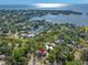 Aerial view of the property showcasing its proximity to the waterfront and lush green surroundings at 320 Lake Maggiore S Blvd, St Petersburg, FL 33705