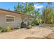 The backyard has a patio with room for seating, mature trees and is partially fenced at 320 Lake Maggiore S Blvd, St Petersburg, FL 33705