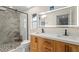 Modern bathroom featuring a double vanity, a glass-enclosed shower, and stylish tile work at 320 Lake Maggiore S Blvd, St Petersburg, FL 33705