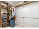 Walk-in closet with wooden shelving and hanging rods, providing ample storage space at 320 Lake Maggiore S Blvd, St Petersburg, FL 33705
