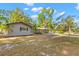 Home with neutral paint, mature trees, carport and long driveway at 320 Lake Maggiore S Blvd, St Petersburg, FL 33705