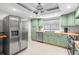 Bright kitchen features stainless steel appliances, ample cabinet space, and modern fixtures at 320 Lake Maggiore S Blvd, St Petersburg, FL 33705
