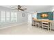 Bright living room with plantation shutters and desk, ideal for a home office, creating a versatile space at 320 Lake Maggiore S Blvd, St Petersburg, FL 33705