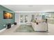Inviting living room featuring a modern sofa, a unique rug, and views into the kitchen at 320 Lake Maggiore S Blvd, St Petersburg, FL 33705