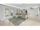 Open-concept living area with a comfortable sofa, French doors, and views into the modern kitchen at 320 Lake Maggiore S Blvd, St Petersburg, FL 33705