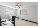 Office space with a chair, desk, and ample natural light, complemented by a ceiling fan at 320 Lake Maggiore S Blvd, St Petersburg, FL 33705