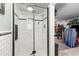 Modern glass shower with white subway tile and black trim, adding a sleek and stylish touch at 320 Lake Maggiore S Blvd, St Petersburg, FL 33705